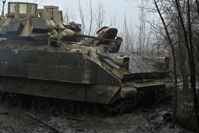 A Ukrainian soldier is seen in Advdiivka