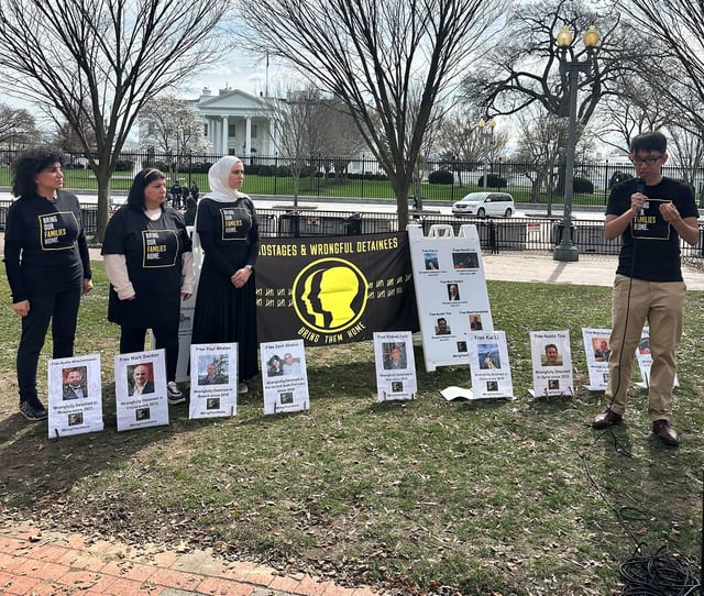 Family members of Americans detained abroad demonstrate in front of the White House on March 8, 2024.