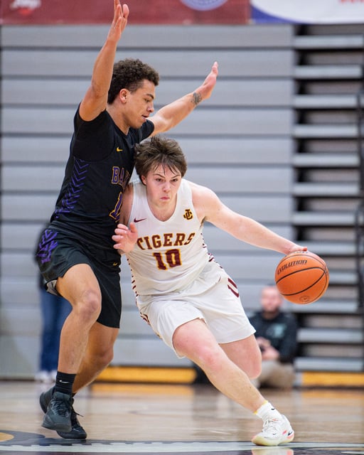 Junction City's Cooper Rothenberger (10) dribbles down the court during the Class 4A OSAA boys state championship on March 9 at Forest Grove High School in Forest Grove.