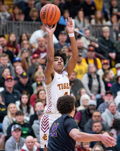 Junction City's Keivon Riley (4) shoots the ball during the Class 4A OSAA boys state championship on March 9 at Forest Grove High School in Forest Grove.