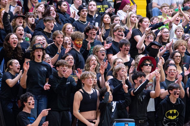 The Junction City student section cheers on their team during the Class 4A OSAA boys state championship on March 9 at Forest Grove High School in Forest Grove.