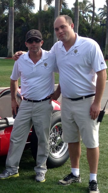 Carlos De Oliveira, left, and Brian Butler, right, pose for a photo in 2014 at Mar-a-Lago in Palm Beach, Florida.