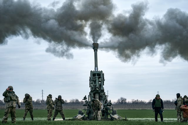 Ukrainian soldiers fire at Russian positions from a U.S.-supplied M777 howitzer in Ukraine’s Kherson region on Jan. 9, 2023. 
