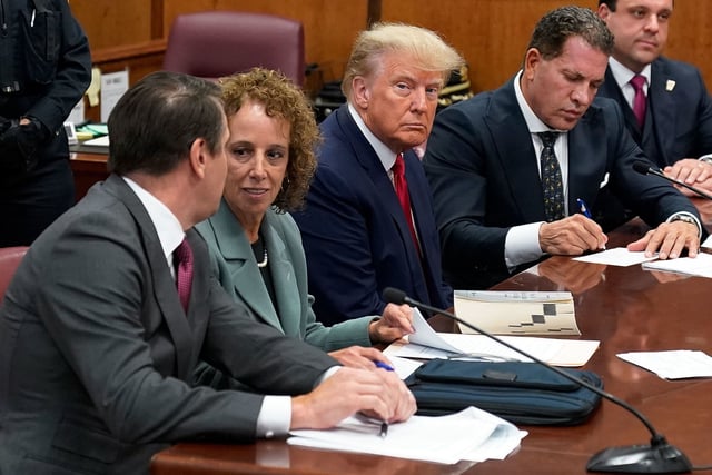 Former President Donald Trump sits at the defense table with his defense team in a Manhattan court during his arraignment on April 4, 2023, in New York City.