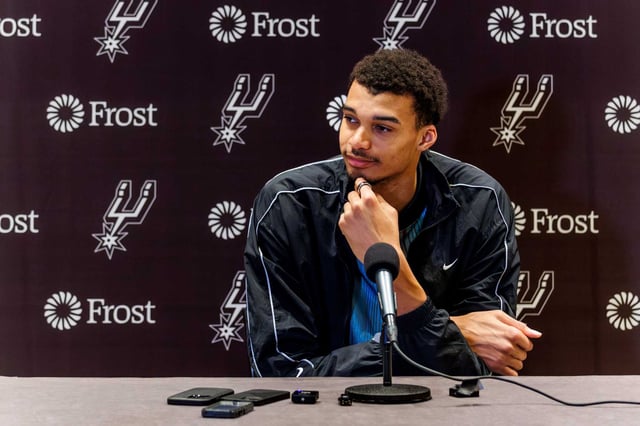 San Antonio Spurs center Victor Wembanyama listens to a question from a reporter after arriving to the team’s hotel on Thursday afternoon, March 14, 2024, in Austin, Texas. The Spurs will be spending the weekend in Austin for their I-35 series games at the Moody Center. They’ll face the Denver Nuggets on Friday, March 15, and the Brooklyn Nets on Sunday, March 17.