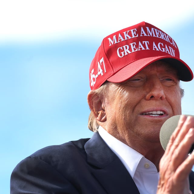 Donald Trump speaks to supporters during a rally at the Dayton International Airport on March 16, 2024 in Vandalia, Ohio. At the rally, Trump said there would be a bloodbath in the U.S. auto industry is Biden was reelected.