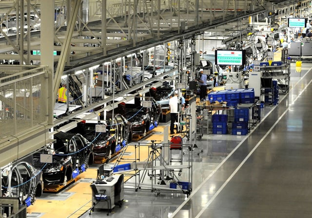 Volkswagen employees work on the assembly line of the 2012 VW Passat in Chattanooga Tennessee, December 1, 2011.