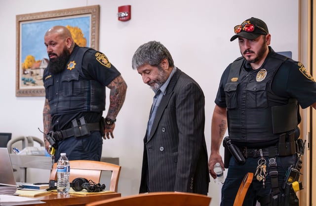 Muhammad Syed enters the court room before opening statements at the Bernalillo County Courthouse in Downtown Albuquerque, N.M,, on Tuesday, March 12, 2024. Syed, an Afghan refugee, is accused in the slayings of three Muslim men in Albuquerque.  (Chancey Bush/The Albuquerque Journal via AP, Pool)