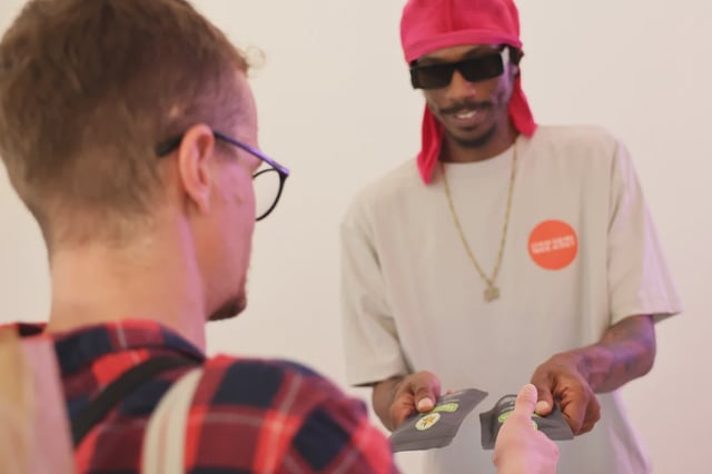 Jack Desa, a recently hired employee with the Union Square Travel Agency marijuana dispensary, helps a customer during his shift in October 2023.