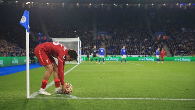 Trent Alexander-Arnold of Liverpool places the ball before taking a corner during the Premier League match between Leicester City and Liverpool