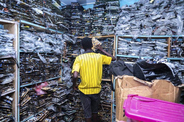 One of the hundreds of small shops for electronics in the narrow streets of an Accra neighborhood in Ghana. Here, broken electronics get dismantled and reused.