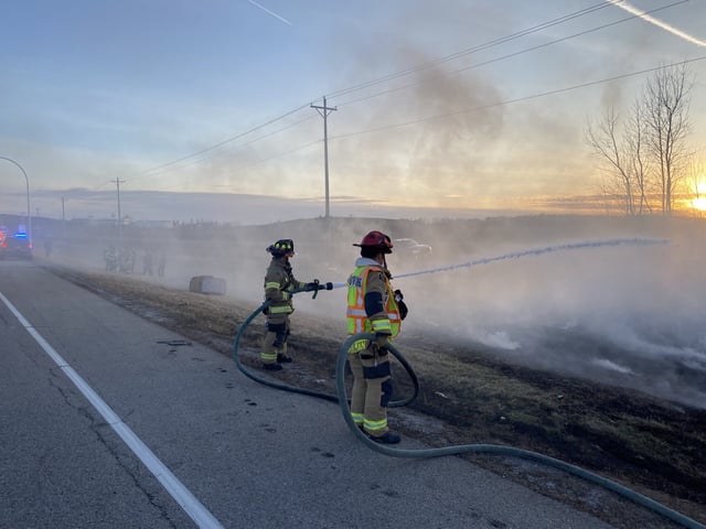 Firefighters put out a brush fire that occurred after a hot air balloon crash. The balloon hit a power line and the basket disconnected from the balloon. The people in the basket only reported minor injuries.