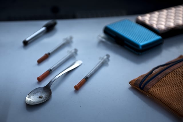 Paraphernalia for smoking and injecting drugs is seen after it was found during a police search on April 19, 2017, in Huntington, West Virginia. Huntington, the city in the northwest corner of West Virginia, bordering Kentucky, has been portrayed as the epicenter of the opioid crisis. On August 15, 2016, from 3:00 pm to 9:00 pm, 28 people in the city overdosed on heroin laced with fentanyl, a synthetic opioid far more powerful and dangerous than heroin. The economic incentives are powerful: one kilogram of fentanyl costs $5,000, which can make a million tablets sold at $20 each for a gain of $20 million. "This epidemic doesn't discriminate," Huntington Mayor Steve Williams said. "Our youngest overdose was 12 years old. The oldest was 77." / AFP PHOTO / Brendan Smialowski / TO GO WITH AFP STORY by Heather SCOTT, US-health-drugs-WestVirginia (Photo credit should read BRENDAN SMIALOWSKI/AFP/Getty Images)