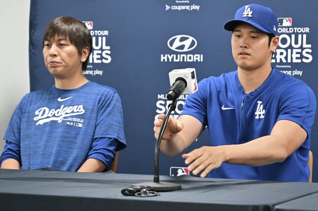 Dodgers two-way player Shohei Ohtani, right, and his interpreter Ippei Mizuhara are shown earlier this week in Seoul. The Dodgers said they fired Mizuhara after the Japanese baseball star’s representatives claimed he had been the victim of “a massive theft” reported to involve millions of dollars. 