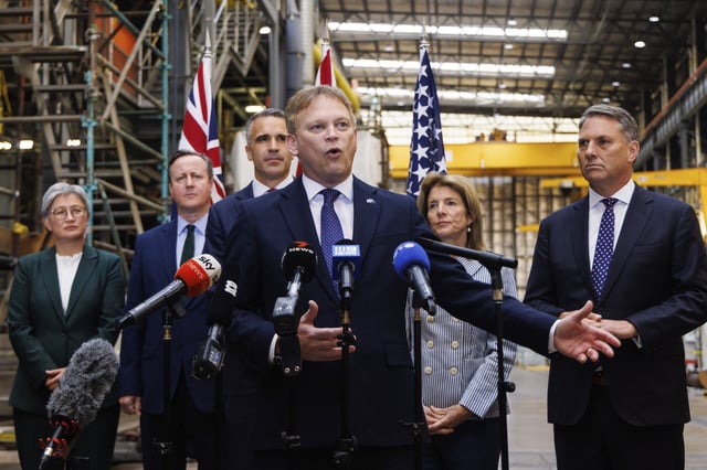 BritainÅfs Secretary of State for Defence Grant Shapps, center, speaks to media as Premier of South Australia Peter Malinauskas, third left, Australian Minister for Foreign Affairs Penny Wong, left, Deputy Prime Minister of Australia Richard Marles, right, BritainÅfs Foreign Secretary David Cameron and United StatesÅf Ambassador to Australia Caroline Kennedy, second right, listen during a visit to the Osborne Naval Shipyard in Adelaide, Australia, Friday, March 22, 2024. Australia is set to provide 4.6 billion Australian dollars ($3 billion) to British industry to support the construction of nuclear-powered submarines and ensure its new fleet arrives on time. (Matt Turner/AAP Image via AP)
