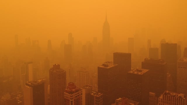 Orange haze from Canadian wildfires fills the sky in New York City in June of 2023.