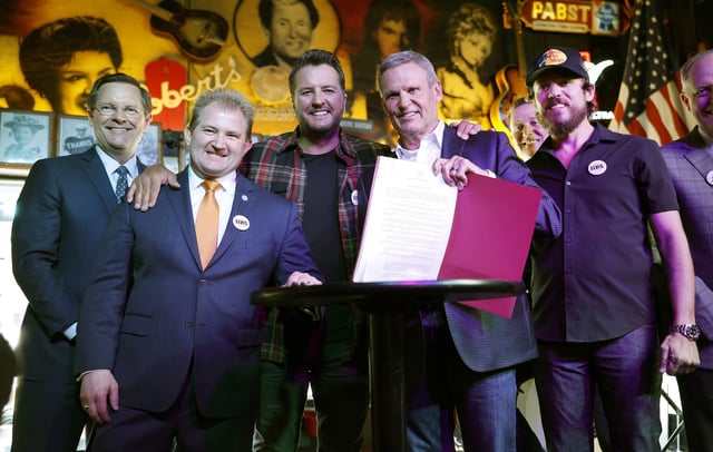 Speaker of the Tennessee House of Representatives Cameron Sexton, Representative William Lamberth, Luke Bryan, Governor Bill Lee, Mitch Glazier, Chris Janson and Senator Jack Johnson are seen at the signing of the ELVIS Act on March 21, 2024 in Nashville CREDIT: Jason Kempin/Getty Images for Human Artistry Campaign