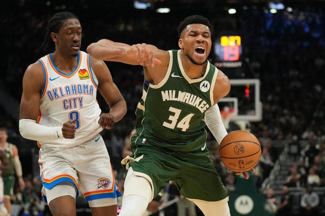 Milwaukee's Giannis Antetokounmpo, reacting to a foul by Oklahoma City's Jalen Williams, scored 30 points and grabbed a season-high 19 rebounds to lad the Bucks over the Thunder 118-93 in an NBA game