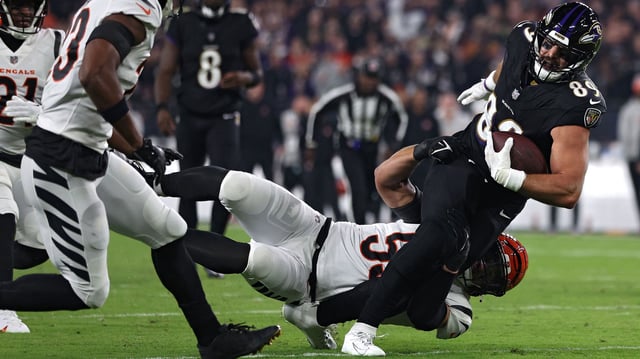 BALTIMORE, MARYLAND - NOVEMBER 16: Mark Andrews #89 of the Baltimore Ravens is tackled by Logan Wilson #55 of the Cincinnati Bengals during the first quarter of the game at M&T Bank Stadium on November 16, 2023 in Baltimore, Maryland. Andrews was injured on the play. (Photo by Patrick Smith/Getty Images)