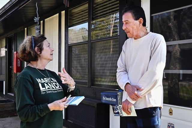 Democratic candidate Marilyn Lands, from left, speaks with Nestor Centeno about her run for office, in Huntsville, Ala., on March 20, 2024.
