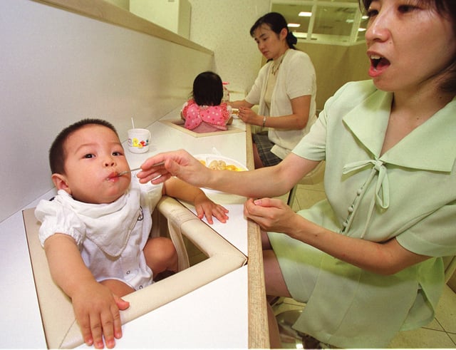 A mother feeds her 11-month-old at a restaurant for infants in a department store in Tokyo. Instead of meeting babies’ needs, Tokyo-based Oji intends to shift its focus to the other end of Japan’s population spectrum. Photo: AP