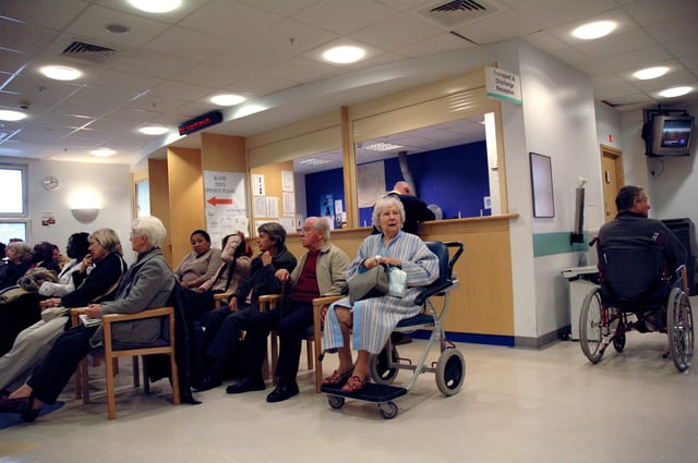 Patients seen in a waiting room at a South London Hospital. Photo: Janine Wiedel Photolibrary / Alamy Stock Photo