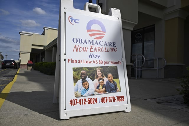 A sign advertising Obamacare health insurance enrollment on March 12, 2024, in Orlando, Fla. 