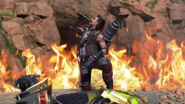 New hero Fuse drinks from a bottle in front of flames