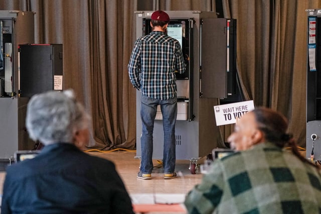 Voters cast their ballots during the Georgia presidential primary elections in Atlanta on March 12, 2024.
