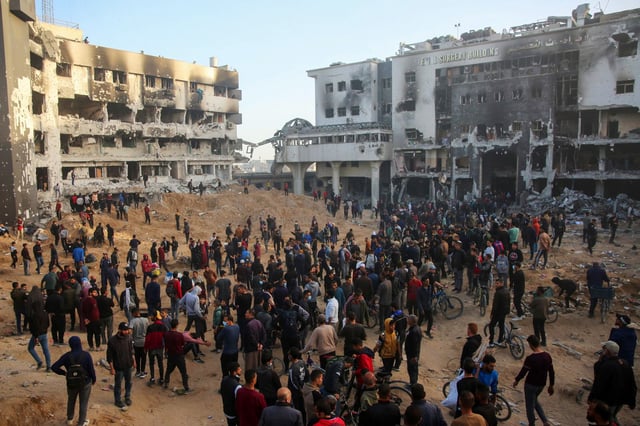 Palestinian civilians outside the embattled al-Shifa hospital in Gaza City on April 1, 2024 after the Israeli military withdrew from the complex.