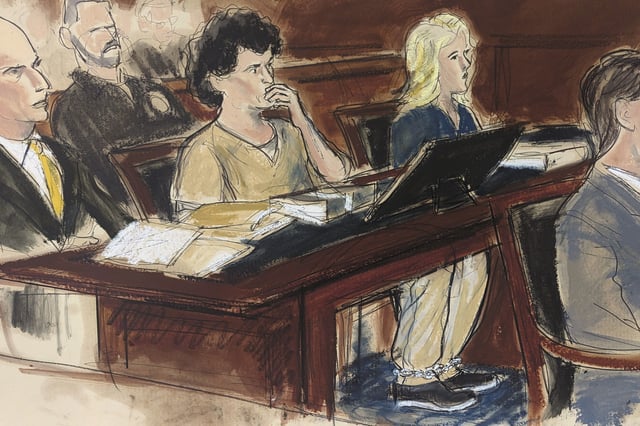 In this courtroom sketch, Sam Bankman-Fried, center, sits at the defense table wearing leg shackles during his sentencing in Manhattan federal court, Thursday, March. 28, 2024, in New York. Crypto entrepreneur Bankman-Fried was sentenced Thursday to 25 years in prison for a massive fraud that unraveled with the collapse of FTX, once one of the world's most popular platforms for exchanging digital currency.