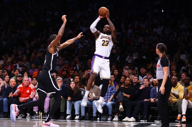 LeBron James connects on one of his nine 3-pointers against the Nets in Sunday's 116-104 win at Barclays Center.