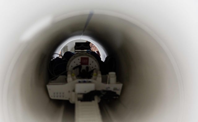 A scientist looks into the Iseult Magneton 11.7 T. Photo: AFP