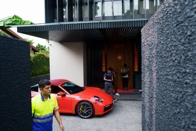A Porsche 911 Targa is seized by police at a residence of Su Jiafeng in Singapore on Oct. 25, 2023. 