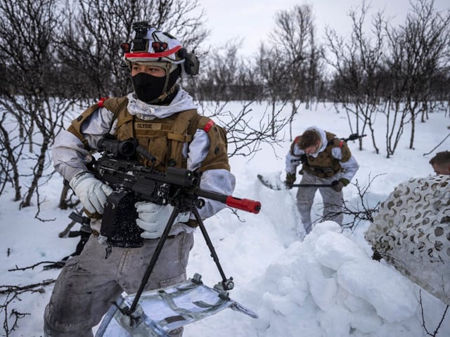 Norwegian Home Guard soldiers of the 17th District Company 'Ida and Lyra', part of the rapid mobilisation force within the Norwegian armed forces, hold a machine gun or dig a trench in the snow as they participate in the Nordic Response 24 military exercise on March 8, 2024, in Alta, above the Arctic Circle in Norway. Nordic Response 24 is part of the larger NATO exercise Steadfast Defender. The exercise involves air, sea, and land forces, with over 100 fighter jets, 50 ships, and over 20,000 troops practicing defensive manoeuvres in cold and harsh weather conditions. (Photo by Jonathan NACKSTRAND / AFP) (Photo by JONATHAN NACKSTRAND/AFP via Getty Images)