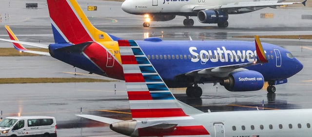 An Airbus A320 passengers aircraft of JetBlue airlines arriving from Tampa is pictured while a Boeing 737 of Southwest airlines arrived from Atlanta and an Airbus A319 arrived from Saint Louis are seen at La Guardia Airport on January 9, 2024. (Photo by Charly TRIBALLEAU / AFP) (Photo by CHARLY TRIBALLEAU/AFP via Getty Images)