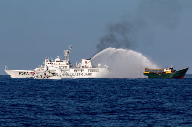 Chinese coastguard vessels fire water cannons at a Philippine resupply vessel in the disputed South China Sea on March 5. Photo: Reuters