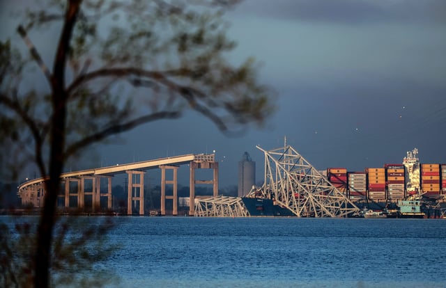 Salvage personal work to clear debris from the Francis Scott Key Bridge on April 4, 2024 in Baltimore.