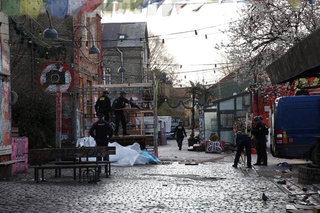 Police clear booths used to sell cannabis from an area known as "Pusher Street" early in the morning in Freetown Christiania in Copenhagen, Denmark, April 6, 2024.