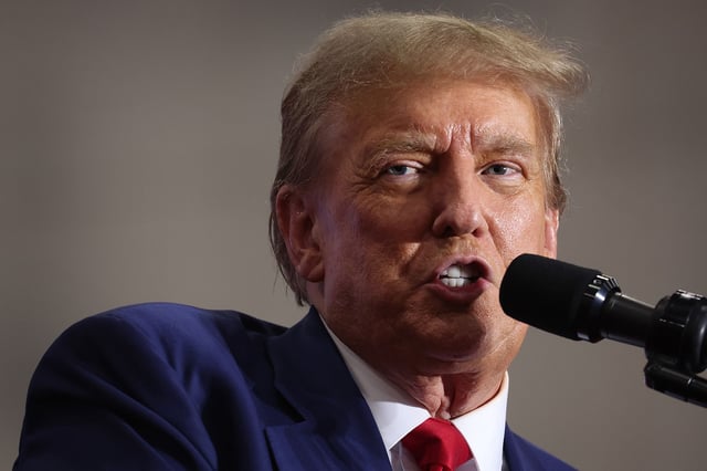 GREEN BAY, WISCONSIN - APRIL 02: Former President Donald Trump speaks to guests at a rally on April 02, 2024 in Green Bay, Wisconsin. At the rally, Trump spoke next to an empty lectern on the stage and challenged President Joe Biden to debate him. The Wisconsin primary is being held today.