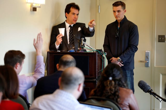 In this November 2018 photo, Jack Burkman, a lawyer and Republican operative, and Jacob Wohl, an internet activist and supporter of then-President Donald Trump, speak during a news conference on their allegations against Special Counsel Robert Mueller in Arlington, Virginia.