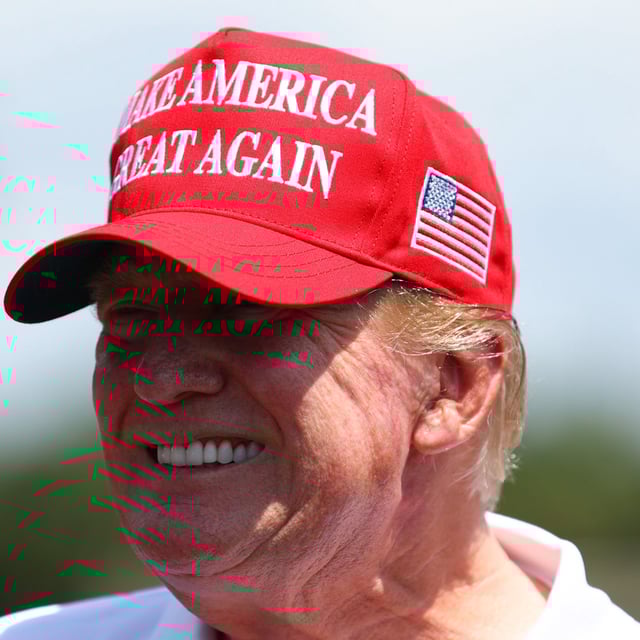 Former U.S. President Donald Trump is seen at the driving range during day three of the LIV Golf Invitational - Miami at Trump National Doral Miami on April 07, 2024 in Doral, Florida. On April 10, 2024, Trump's son, Eric, said that anytime the former president enters a court room, he receives "millions of dollars."