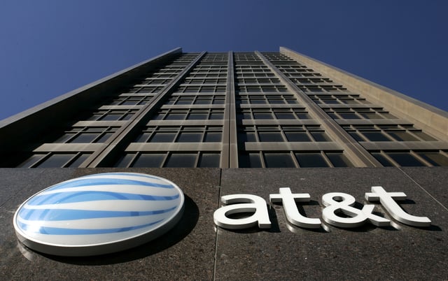 a photo of at&t's headquarters as if looking up to the sky from the entrance