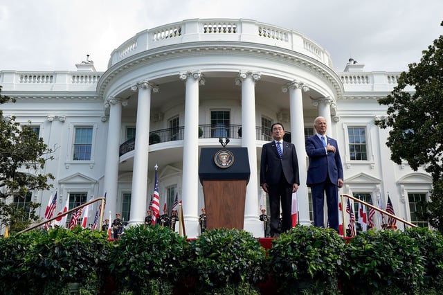 President Joe Biden and Japanese Prime Minister Fumio Kishida listen to the National Anthem during a State Arrival Ceremony on the South Lawn of the White House, Wednesday, April 10, 2024, in Washington. (AP Photo/Alex Brandon)