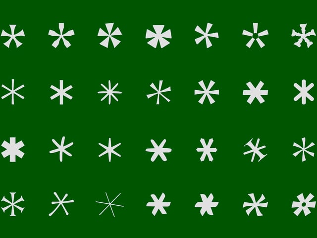 a set of white asterisks of different fonts symbolizing passwords on a green background