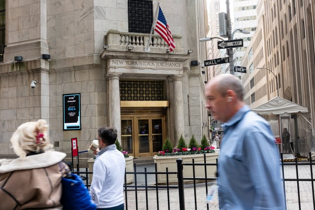 People walk past the New York Stock Exchange (NYSE) on April 10, 2024 in New York City.