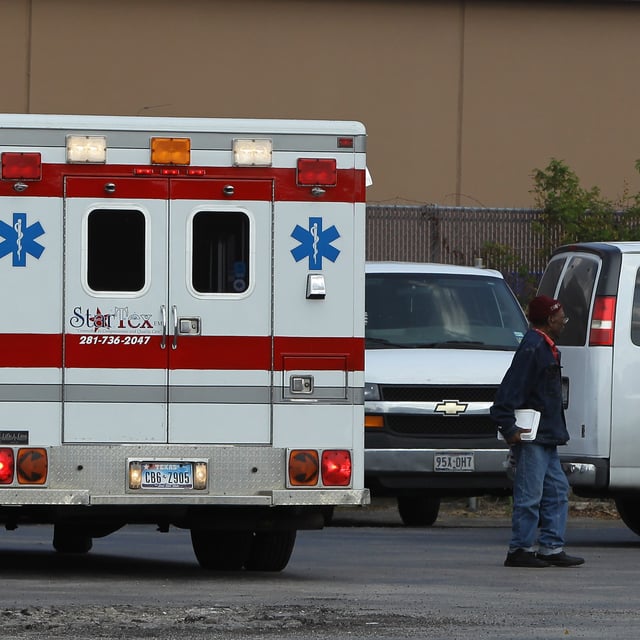A man gets out of an ambulance to visit a clinic in Houston, Texas on October 18, 2010. On Friday, a commercial vehicle crashed into a building in Brenham, Texas, according to local reports.