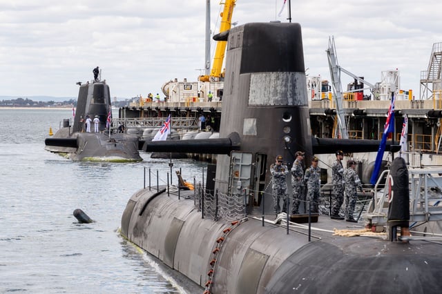 An Australian Collins class submarine and the UK nuclear-powered attack submarine HMS Astute dock at an Australian Navy base in Perth, Western Australia on October 29, 2021. Photo: EPA-EFE