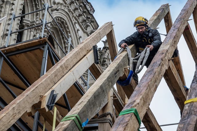 Carpenter Hank Silver making repairs to the Notre Dame Cathedral in Paris. 