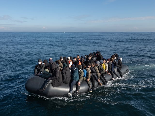 ENGLISH CHANNEL - MARCH 06: An inflatable dinghy carrying around 65 migrants crosses the English Channel on March 06, 2024 in the English Channel. According to official figures 401 migrants arrived in the UK by small boat on Monday, the busiest day of the year so far for Channel crossings. This brings the provisional total number of UK arrivals so far this year to 2,983. Government data indicates this is more than the 2,953 logged this time last year and surpasses the running totals documented between January 1 and March 4 each year since current records began in 2018. (Photo by Dan Kitwood/Getty Images)